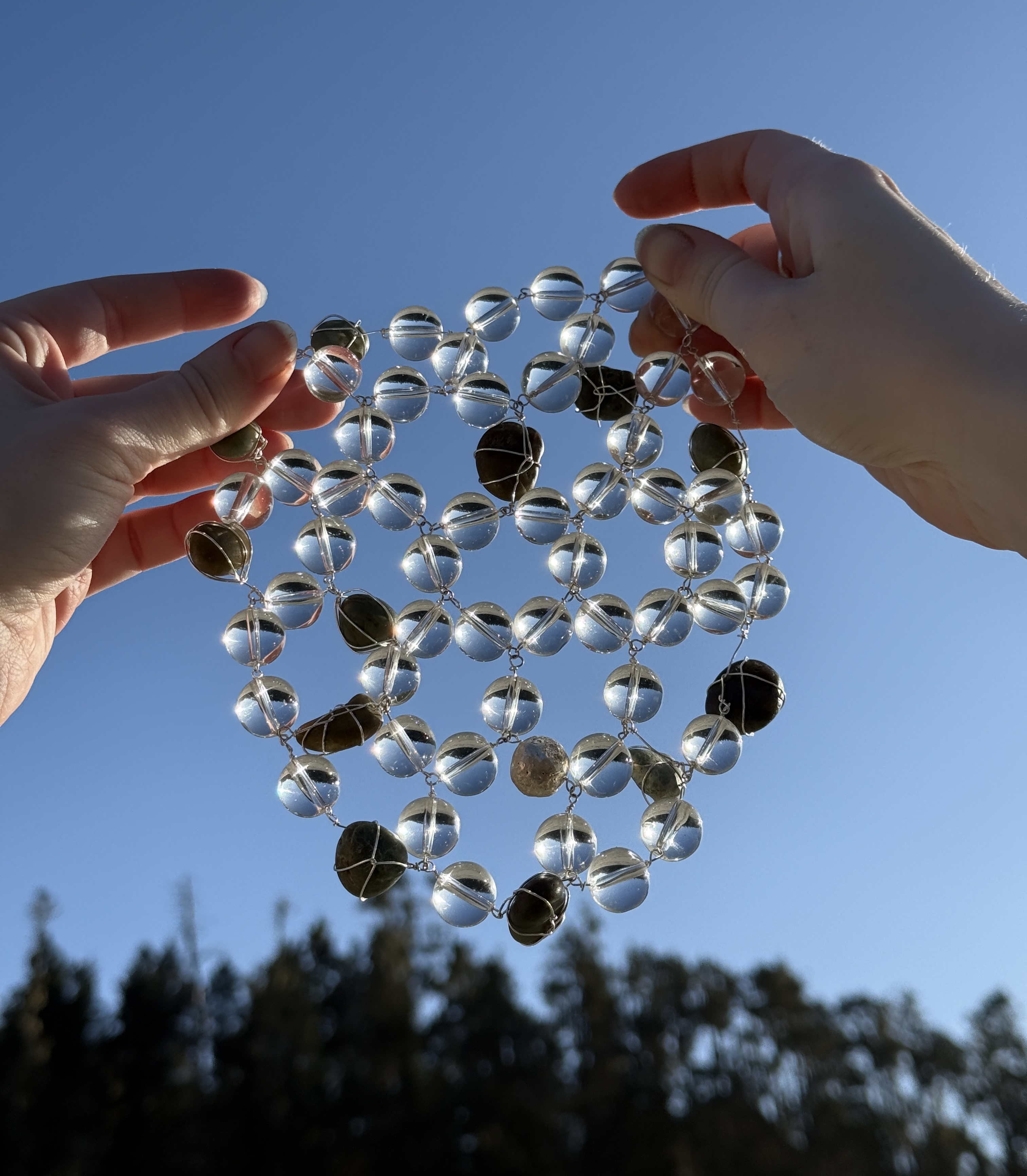 a ring of glass beads interspersed with stones